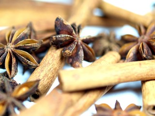 Star anis with cinnamon barks on white background