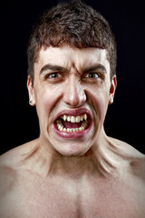 Stress concept - angry furious mad man