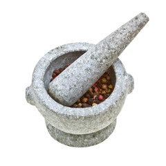 stone mortar and pestle with crushed pepper isolated on white