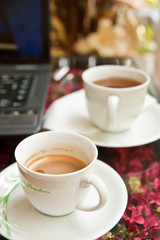Coffee cup and notebook