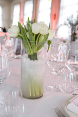Decoration of the dining table for Valentine's Day. White tulip.