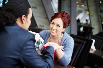 Beautiful Bride at table in cafe