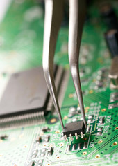 Assembling a circuit board.