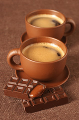 Cups of coffee and chocolate