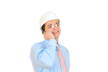 An engineer  talking on his mobile phone on white