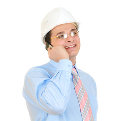 engineer with white hard hat talking on his mobile phone