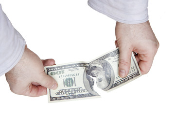 Tearing dollar bill