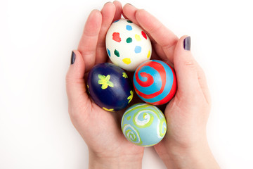 Four Colorful Easter Eggs in the Hand
