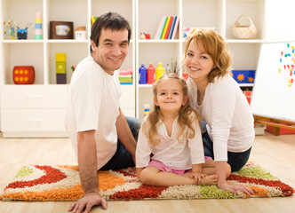 Happy family together sitting on the floor