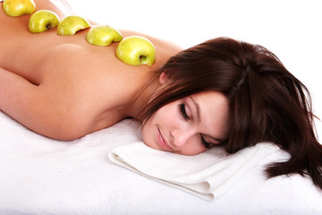 Beautiful girl on spa resort. Fruit massage.