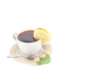 full cup of tea with lemon