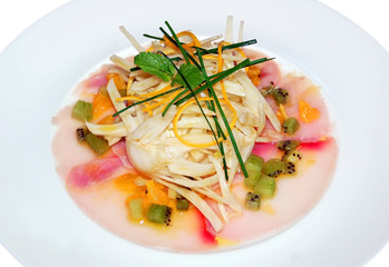 fresh salad with fruits and vegetables on the plate