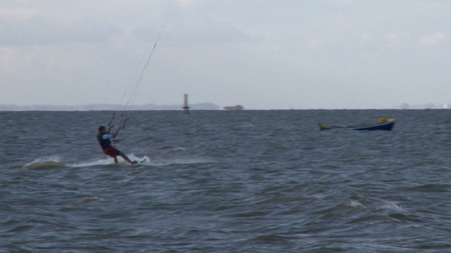Kitesurfer in action jumping