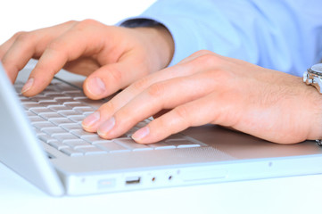 Young businessman is working in a laptop