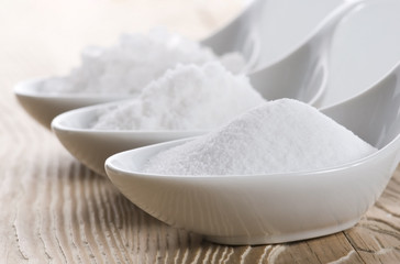 three spoons with difrent salt