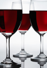 Three red wine glasses