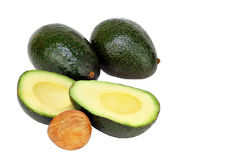 Avocados cut and whole isolated on white with copy space.
