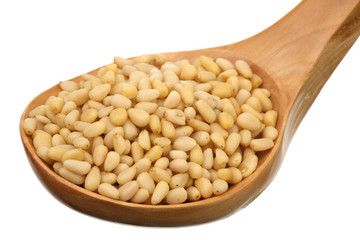 Pine nuts in a wooden spoon