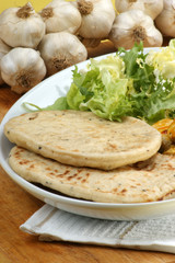 naan bread with turkey curry on a plate
