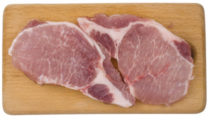 Pieces of fresh meat on cutting board