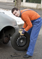 Obraz na płótnie Canvas tire repairer working