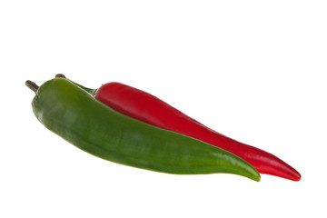 Red and green spicy peppers isolated over white background.
