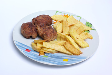 Meatballs with french fries isolated on white