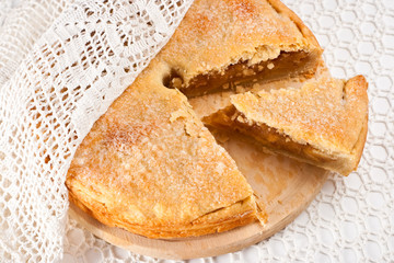 The apple pie with a lacy napkin
