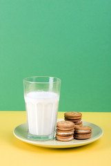 Plate of milk cream filled shortcake and a glass of milk