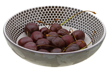 Sweet cherry in a plate isolated on white