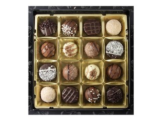 Box of assorted chocolates on white background