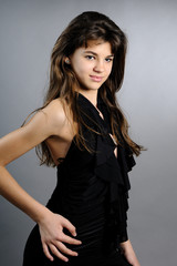 beautiful brunette girl posing in black dress