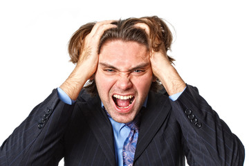 Young businessman in panic pulling his hair on white background