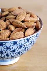 Some almonds on a small Japanese bowl