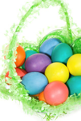 Easter basket with  colorful  eggs