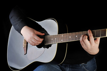 man playing on guitar