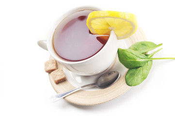 full cup of tea with lemon