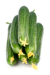 Pile of fresh cucumbers isolated on white