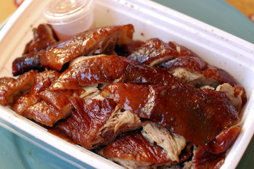Chopped Chinese roasted duck in a container