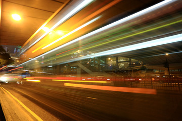 Fototapeta na wymiar fast moving bus at night in Hong Kong