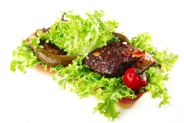 meat served on raw green salad