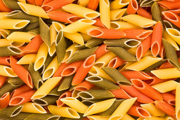 multi-coloured macaroni, a background, a structure