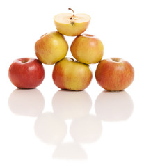 Apples isolated on white in pyramid