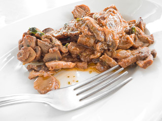 Mushrooms cooked with olive oil, tomato sauce and parsley.