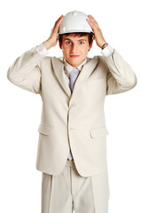 Handsome young man with hardhat on white