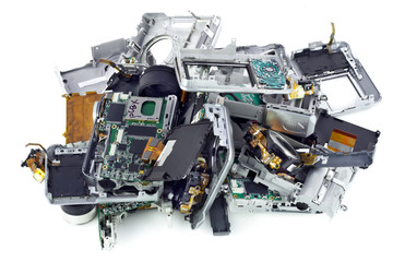 Broken mass digital cameras  on a garbage dump