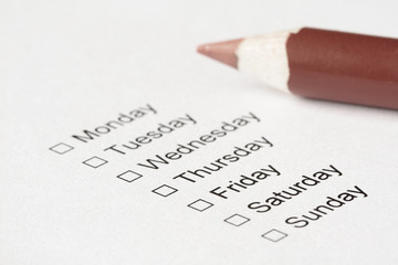 The days of week with checkboxes and pencil to mark