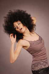 Attractive woman posing with afro hair