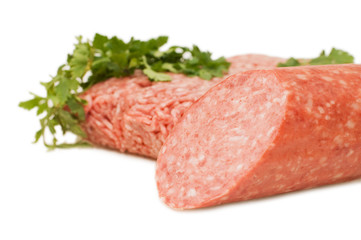 Forcemeat and sausage  isolated on white background