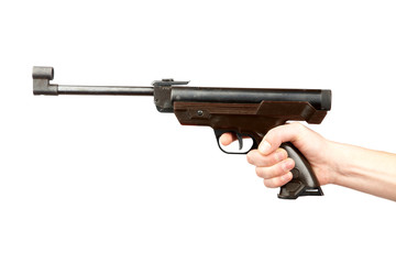 The man's hand holds pneumatic pistol